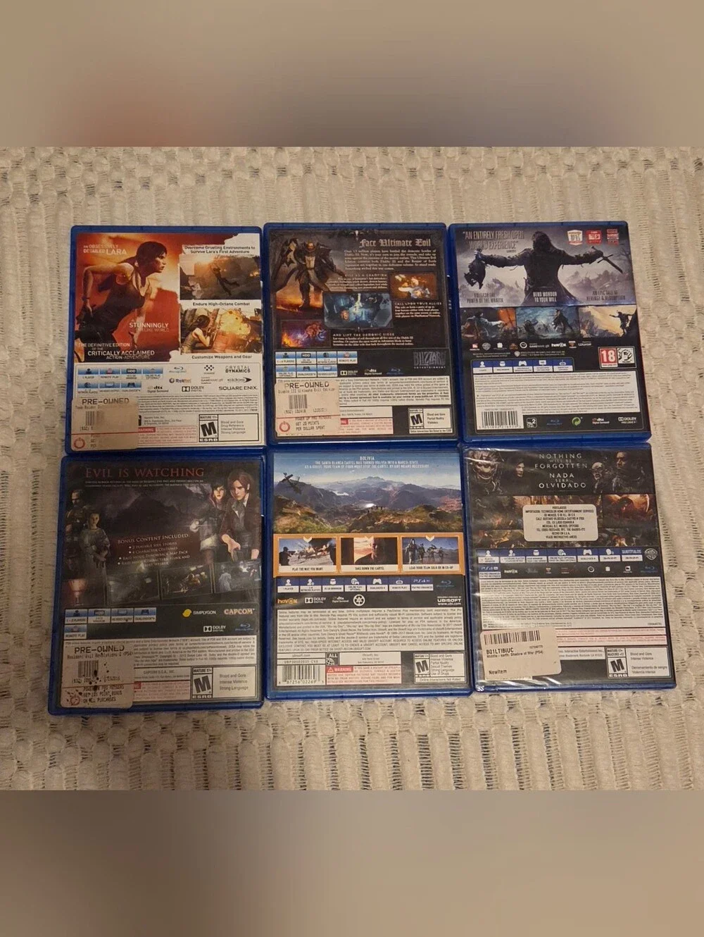 PS4 Game Lot — Blue Cases with Multi-Game Covers
